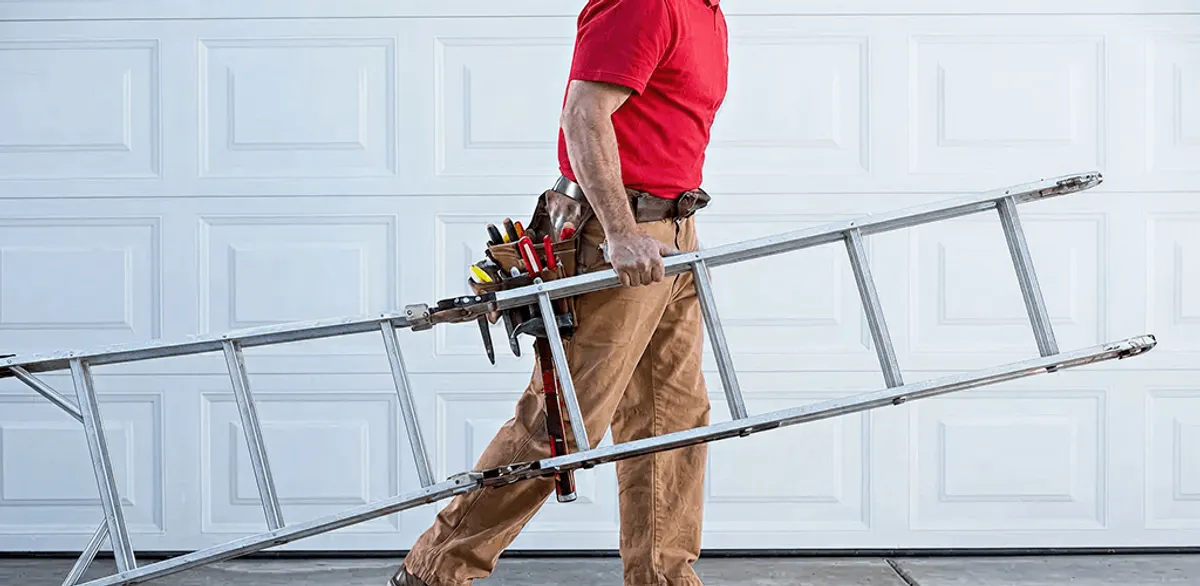 Garage door repair technician arriving with tools and ladder in Mesa, AZ